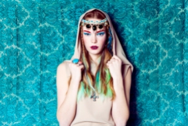 Model is wearing braided necklace by Jolita Jewellery as a headpiece