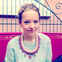 Sasha in Jolita Jewellery's colourful statement necklace braided with yellow, a hint of turquoise and pink hand-dyed silks
