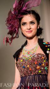 Fashion Parade event, supporting Save The Children charity. A catwalk with Nomi Ansari design and hand-painted Carnival statement necklace by Jolita Jewellery.